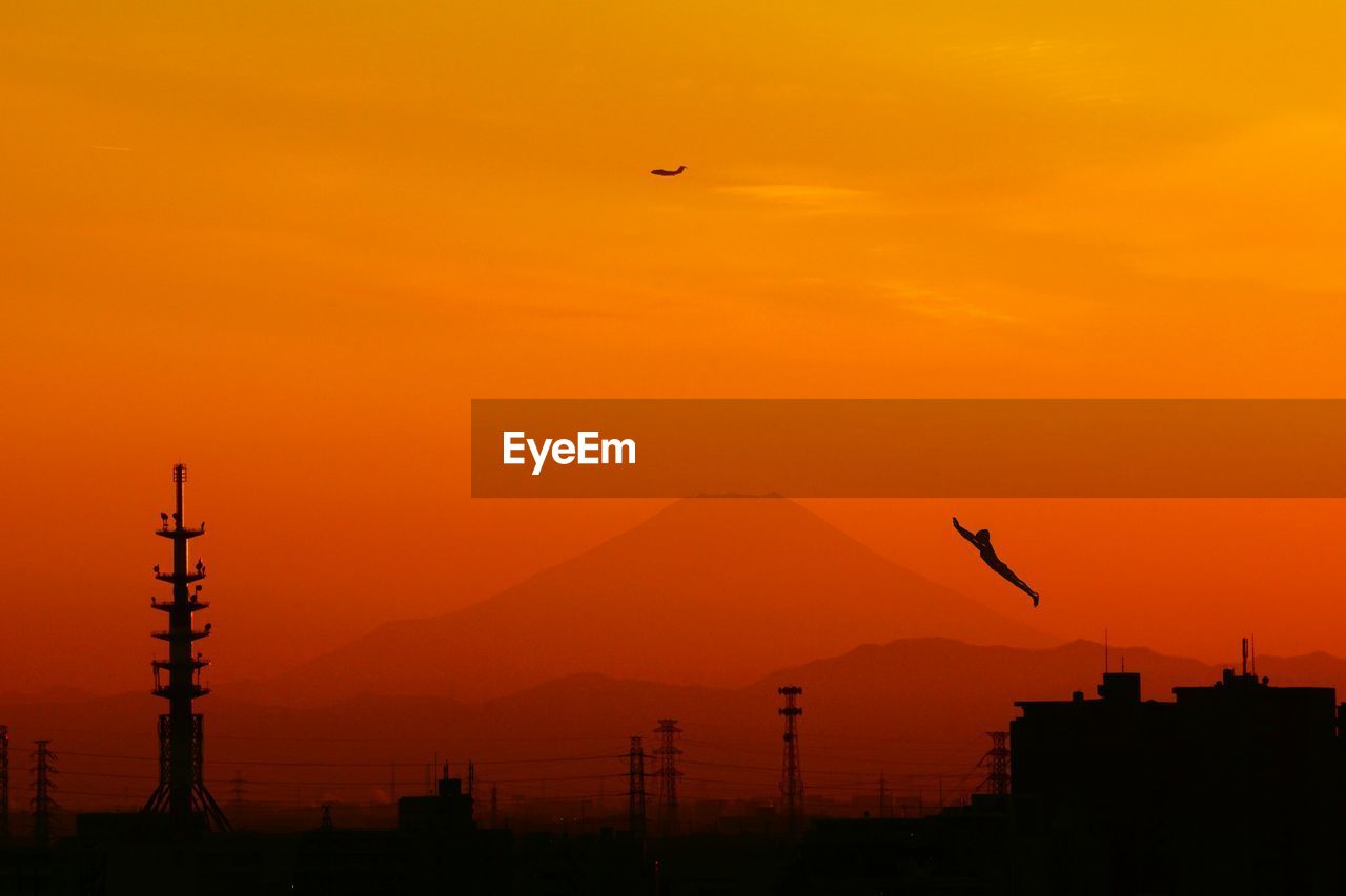 Scenic view of mt fuji against orange sky during sunset