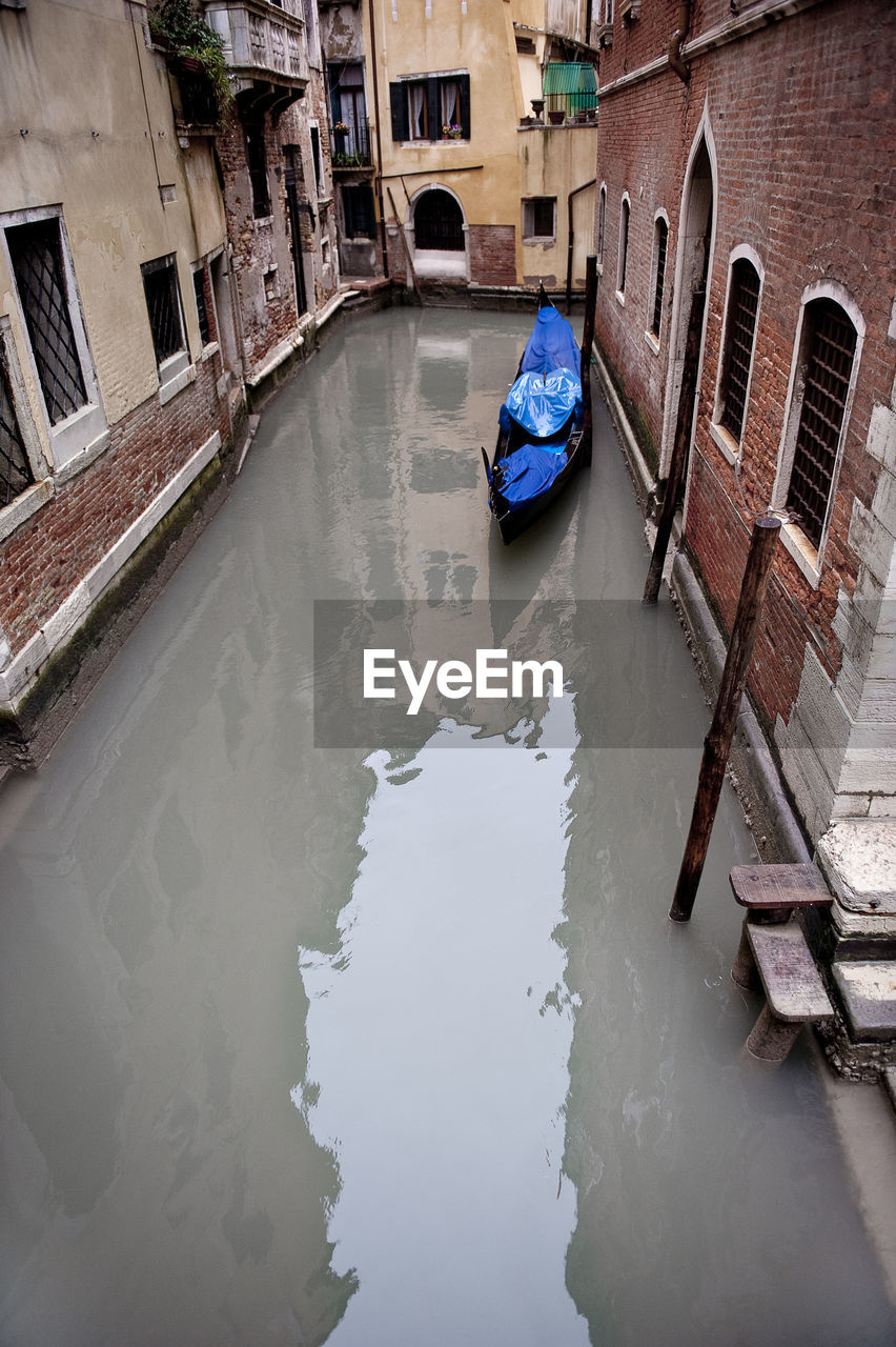 High angle view of gondola moored in canal