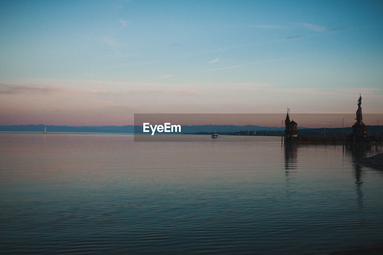 Scenic view of sea against sky at sunset