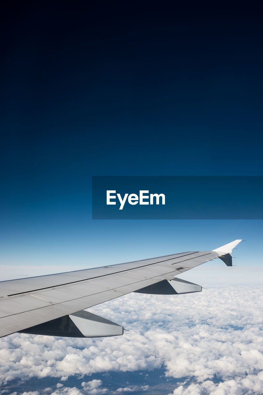 Airplane flying over blue sky