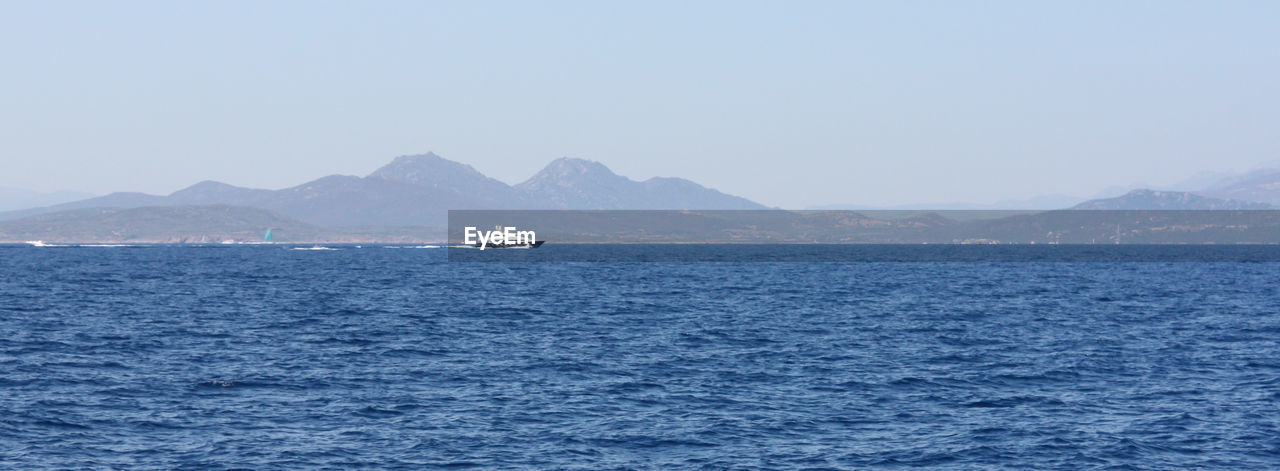 Panoramic view of sea against clear sky