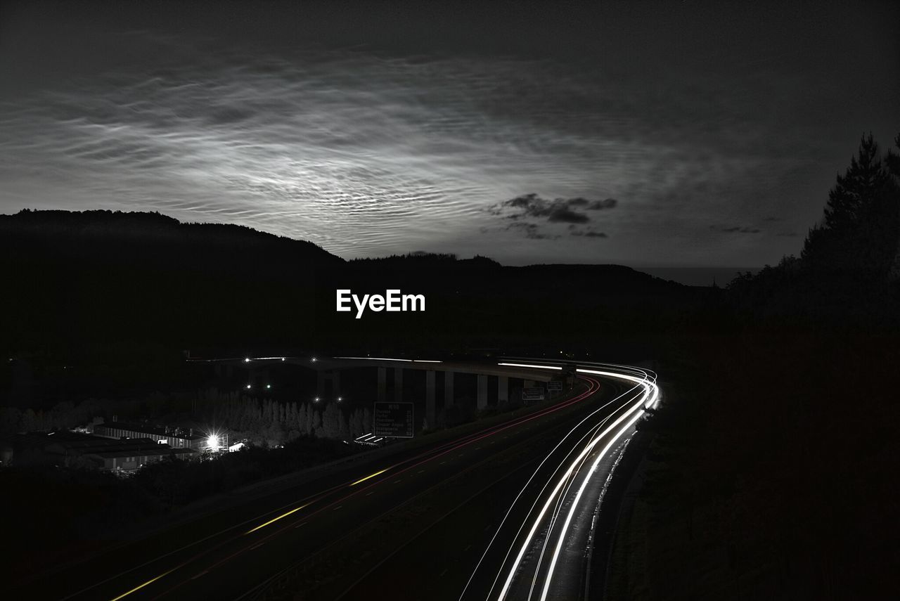 High angle view of light trails on highway at night