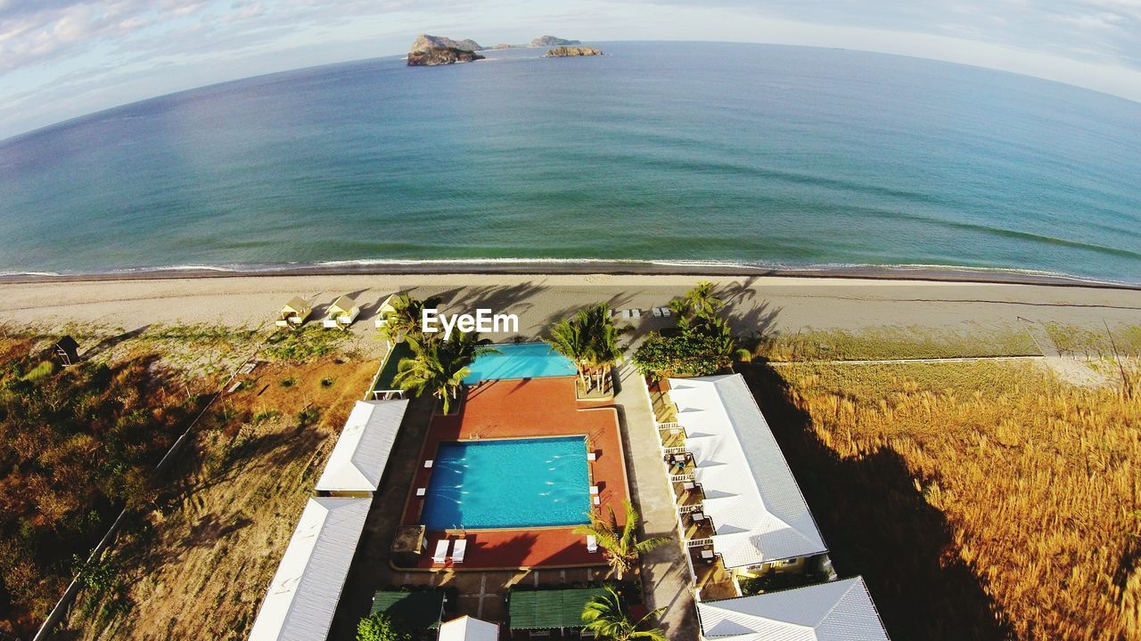 Aerial view of resort in front of sea at beach