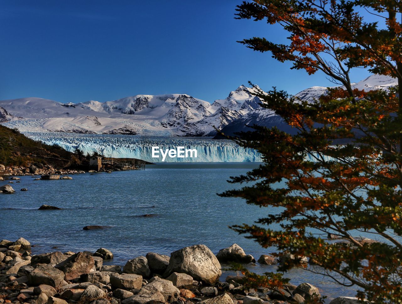 SCENIC VIEW OF SNOWCAPPED MOUNTAIN AGAINST SKY