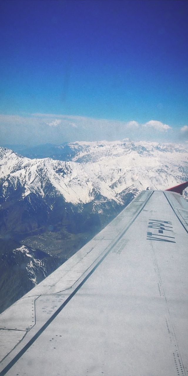 SCENIC VIEW OF SNOWCAPPED MOUNTAINS AGAINST BLUE SKY