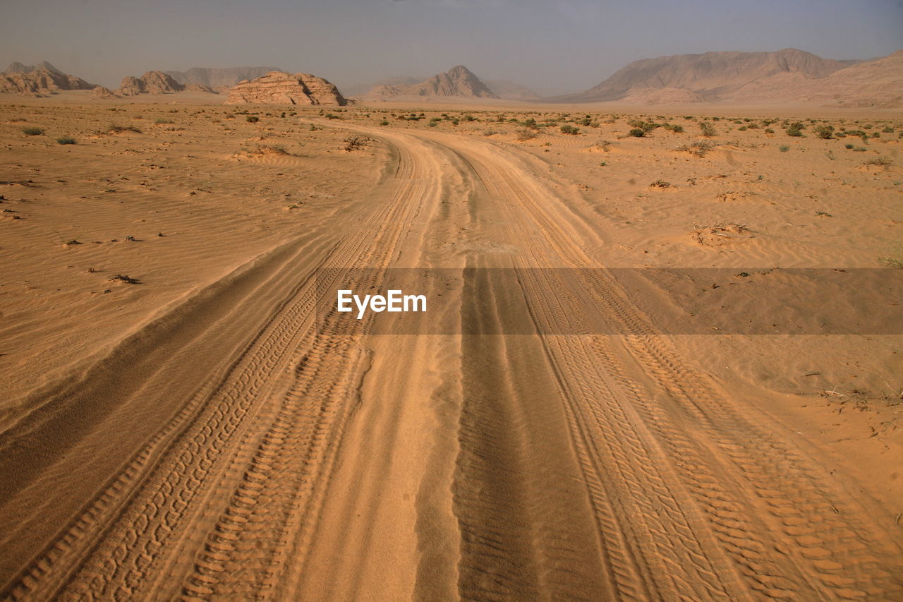 Tire tracks on sand in desert