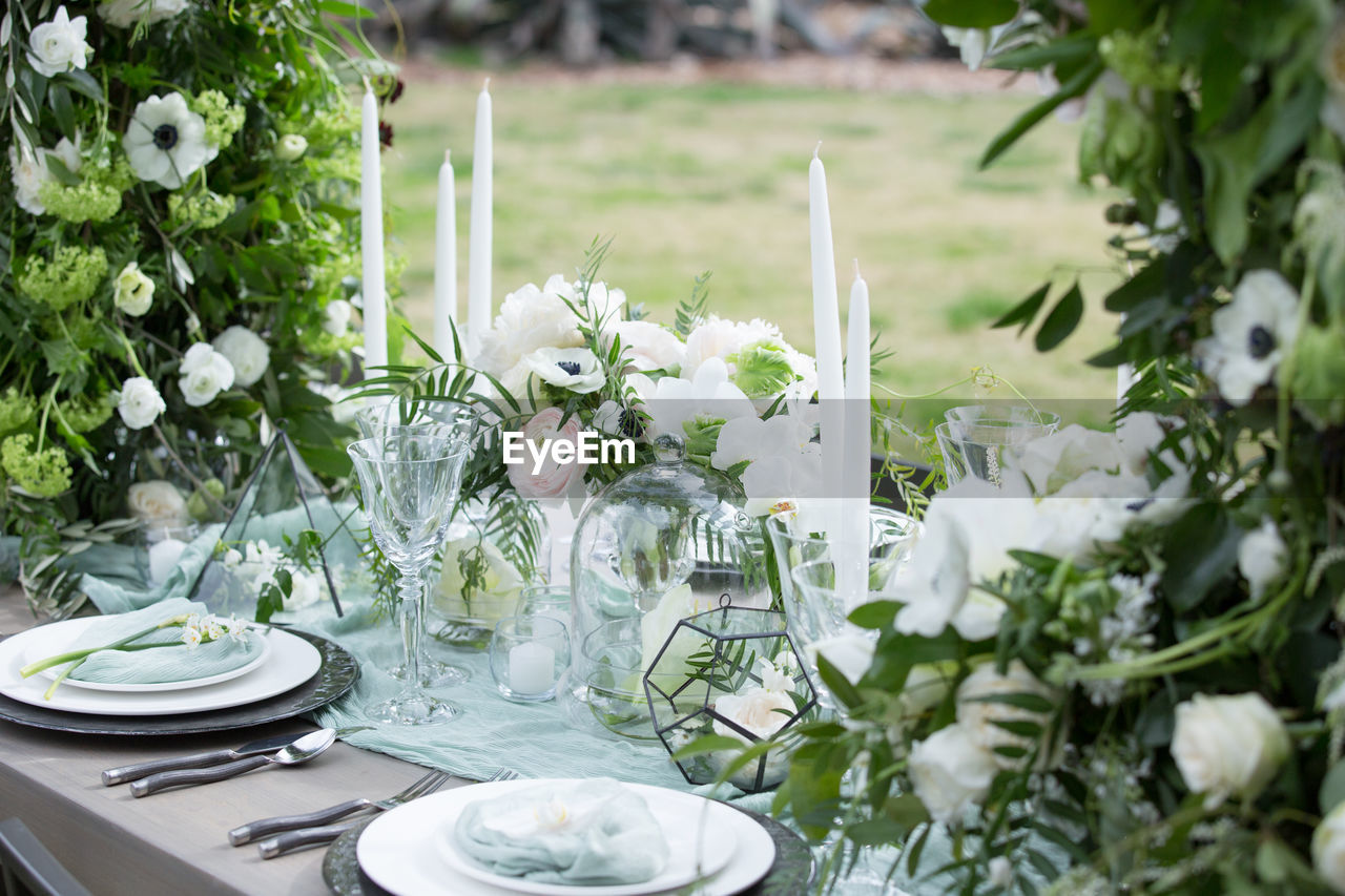 WHITE FLOWERS IN VASE ON TABLE