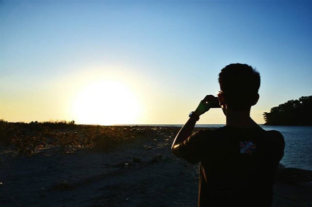 SCENIC VIEW OF SEA AT SUNSET