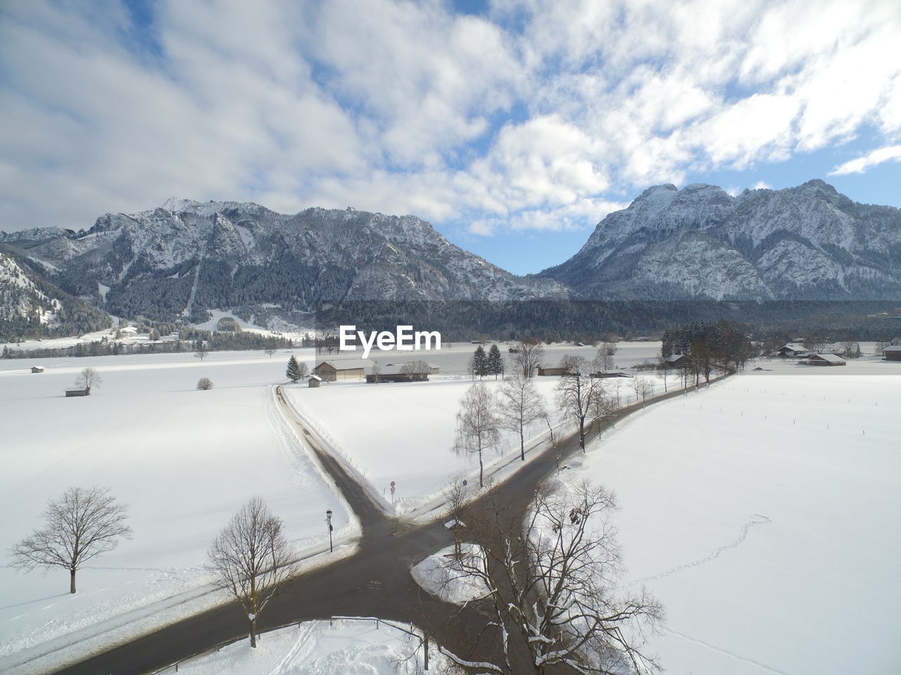 Scenic view of snowcapped mountains and lake against sky