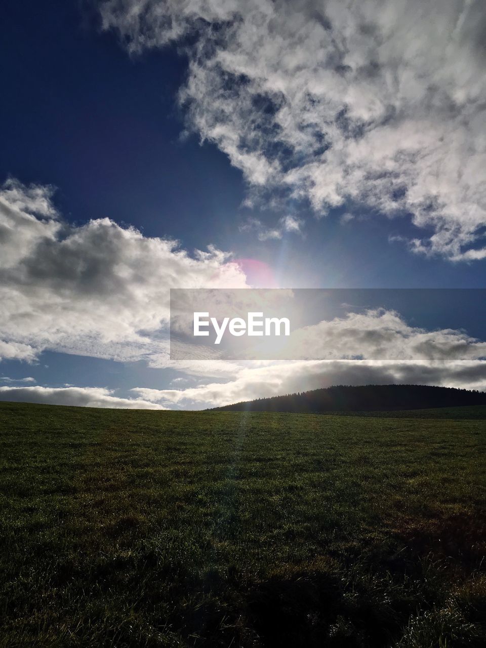 SCENIC VIEW OF FIELD AGAINST CLOUDY SKY