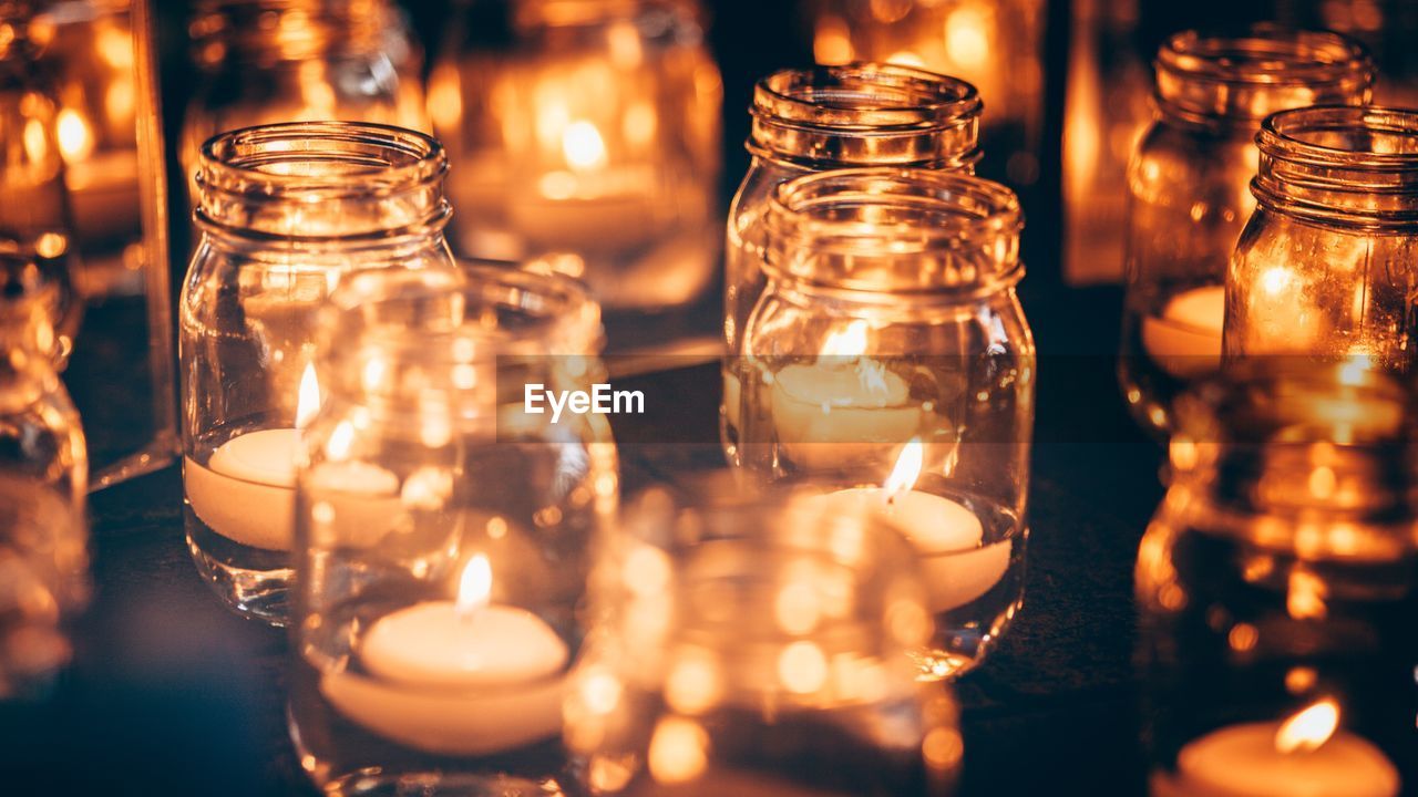 Close-up of tea light candles on table