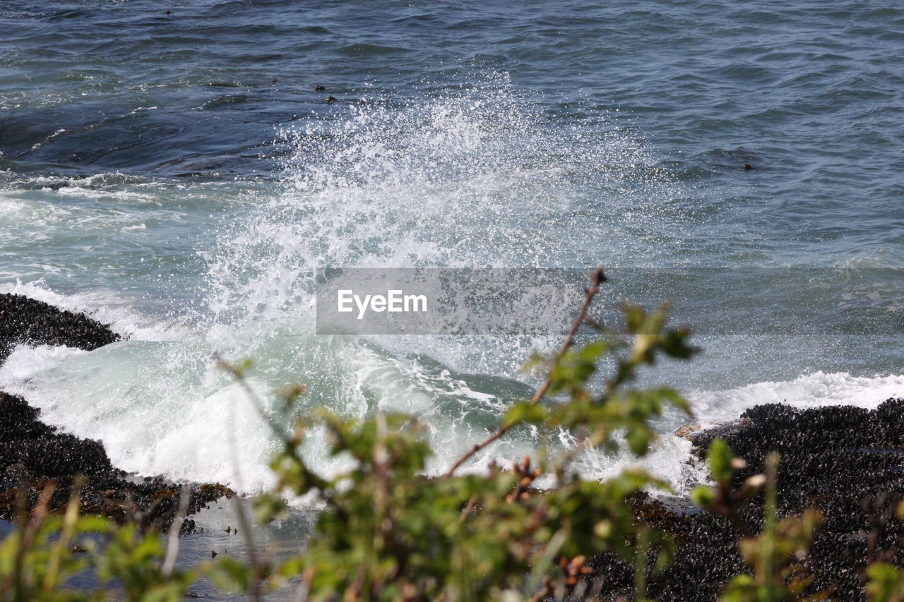 Close-up of waves splashing on sea