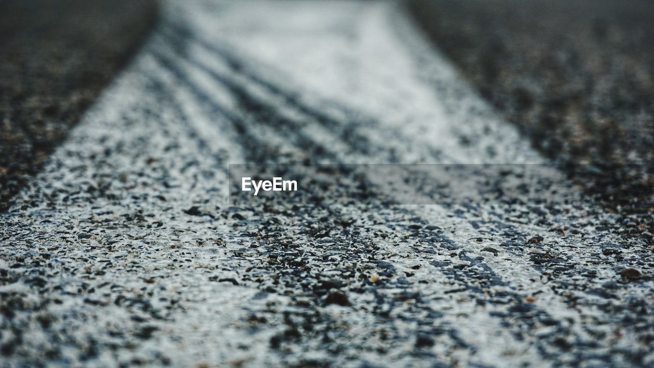 Full frame shot of tire marks on road