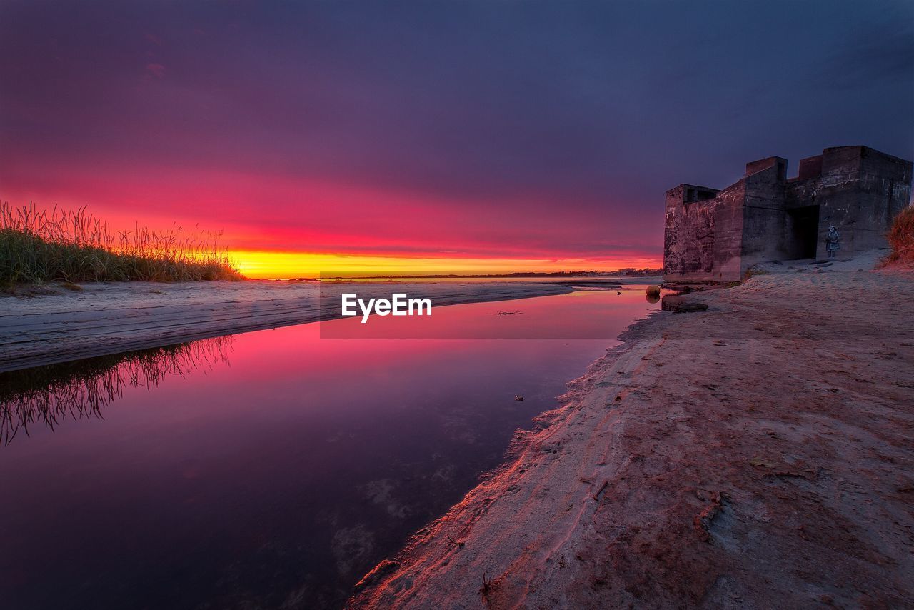 Scenic view of sea against sky at sunset