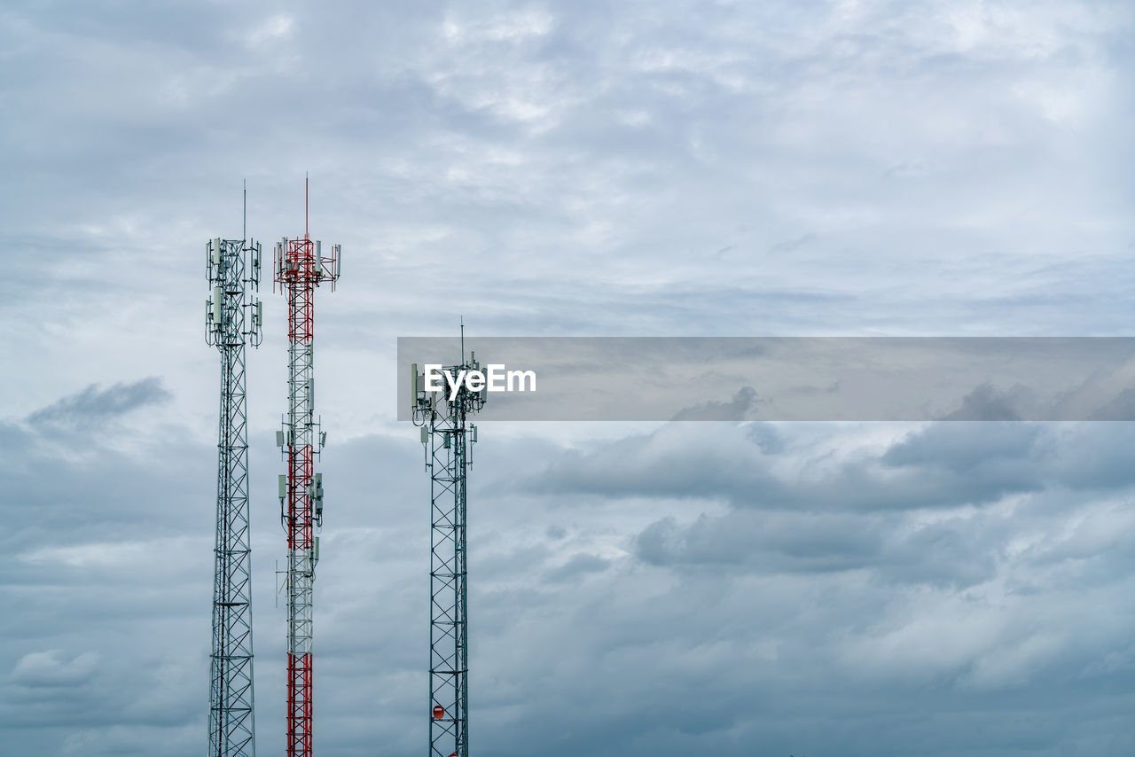 Telecommunication tower with white cloudy sky. antenna. radio and satellite pole. communication.