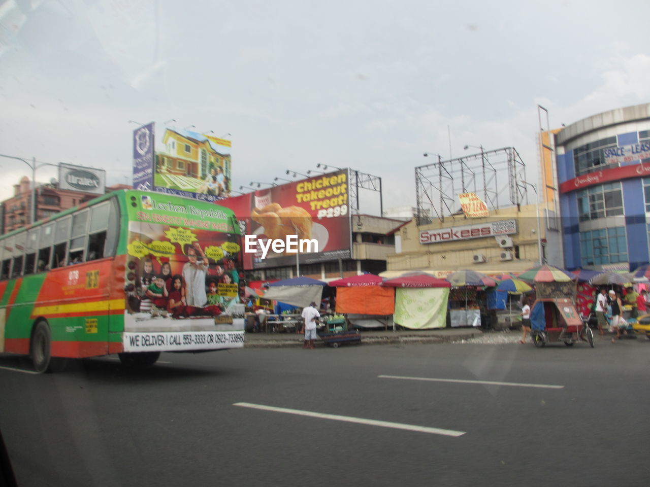 VIEW OF CITY STREET WITH BUILDINGS IN BACKGROUND