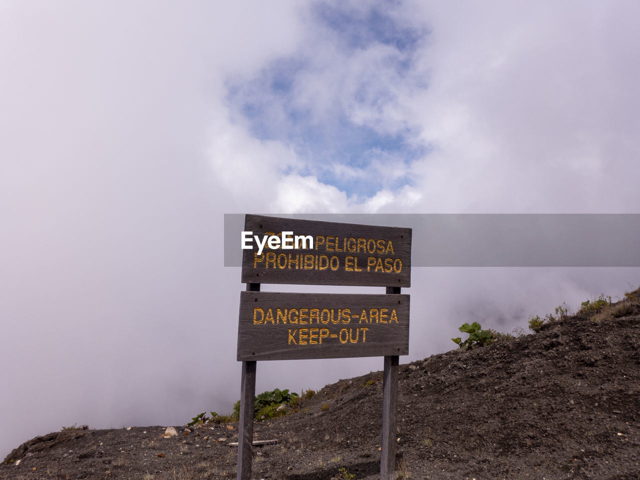 INFORMATION SIGN BOARD AGAINST SKY