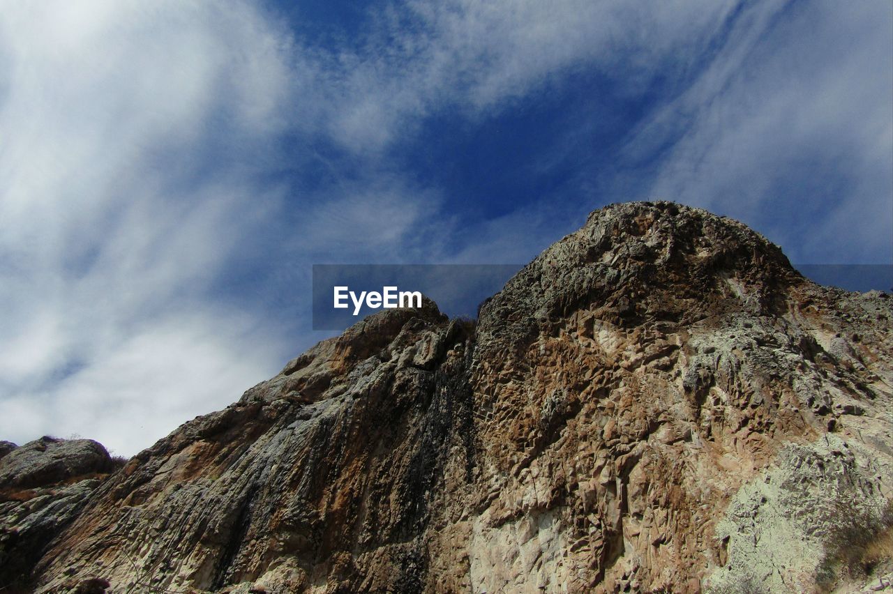 Low angle view of mountain against sky