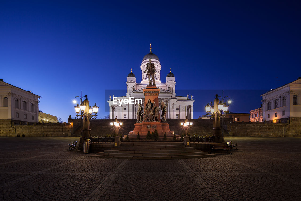 ILLUMINATED BUILDING AGAINST BLUE SKY
