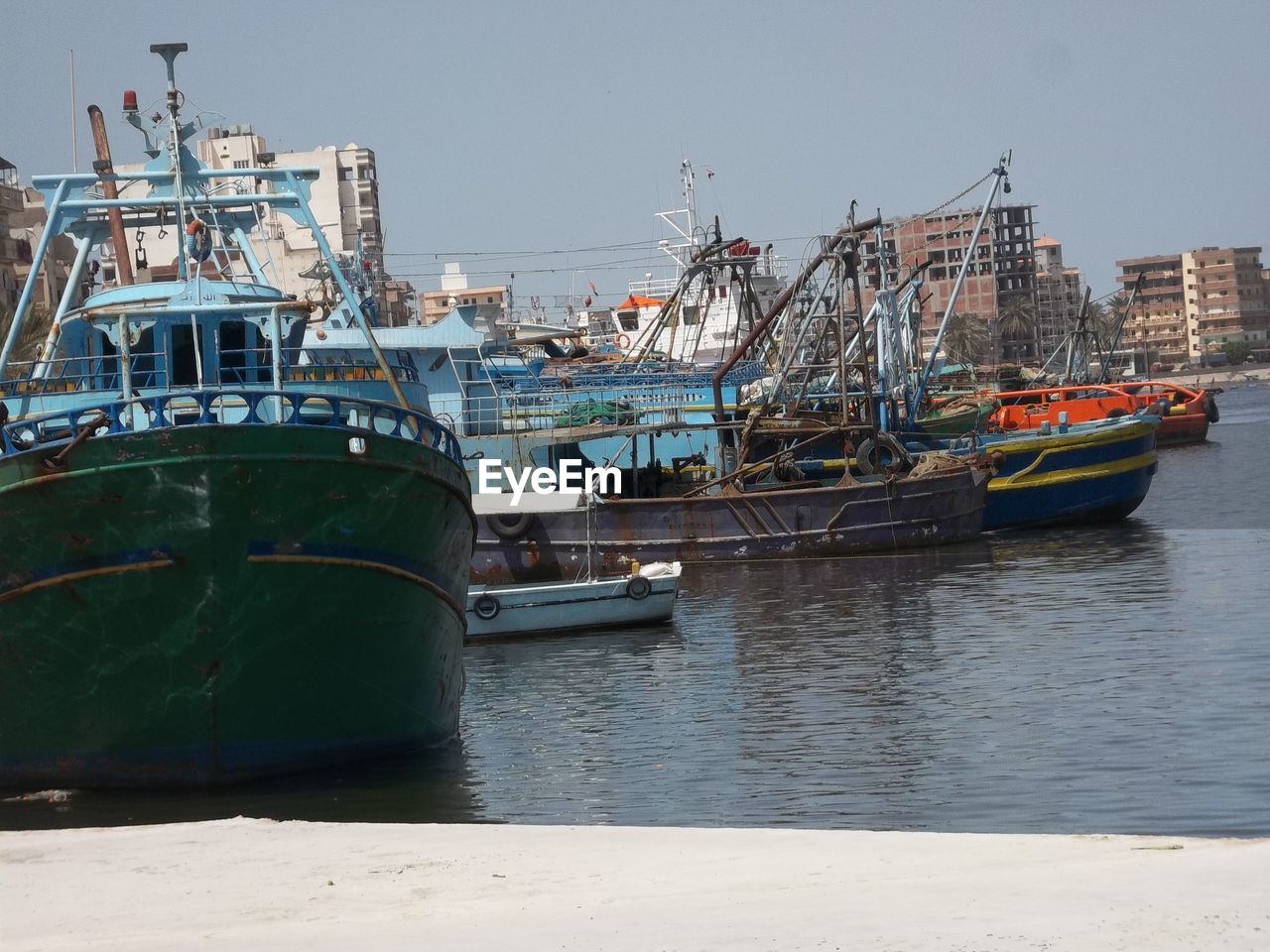 water, nautical vessel, transportation, sea, mode of transportation, harbor, vehicle, architecture, boat, nature, freight transport, ship, coast, tugboat, watercraft, no people, moored, pier, port, infrastructure, channel, sky, waterway, outdoors, city, travel, day, commercial dock