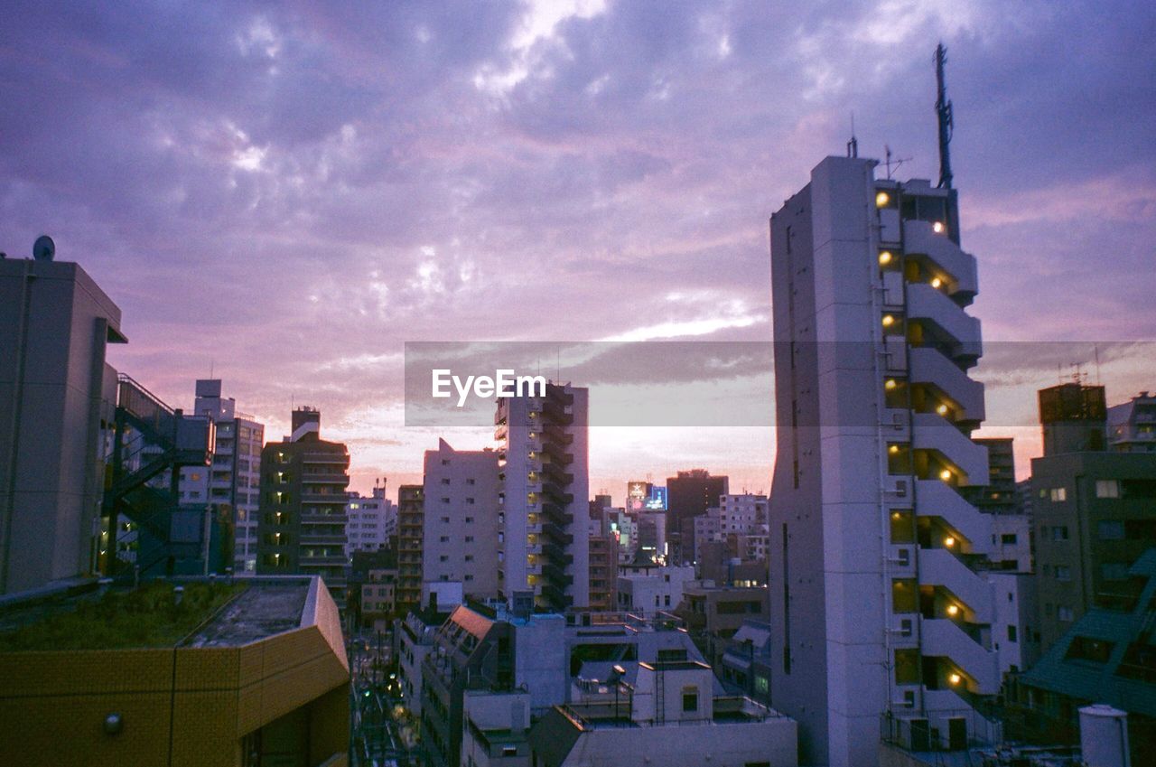 BUILDINGS AGAINST SKY DURING SUNSET