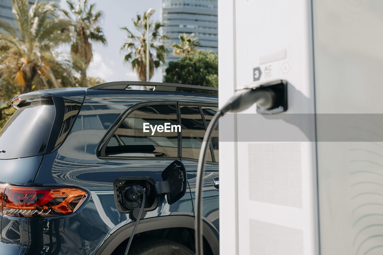 Electric car charging at station