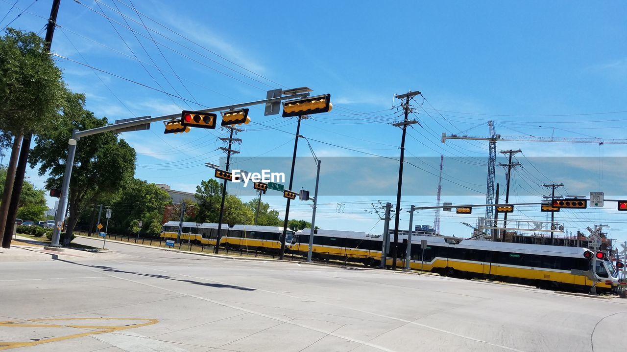 LOW ANGLE VIEW OF CARS AGAINST SKY