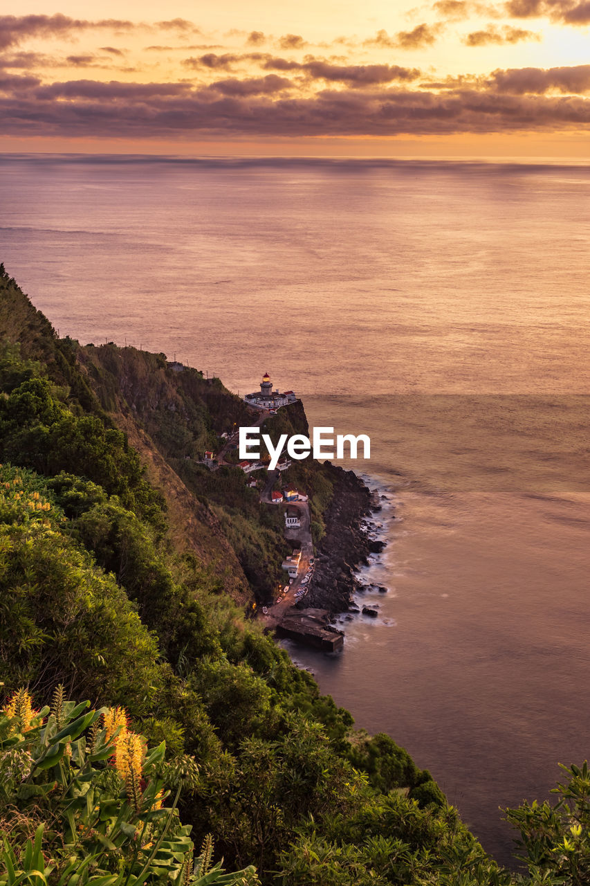 View of lighthouse farol do arnel from viewpoint vista dos barcos on sao miguel island, azores 