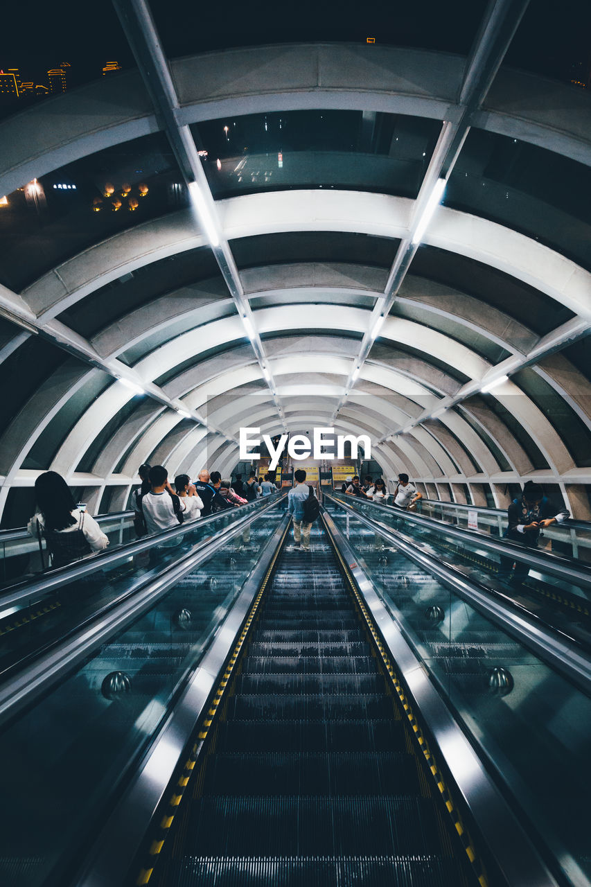 People standing on escalator