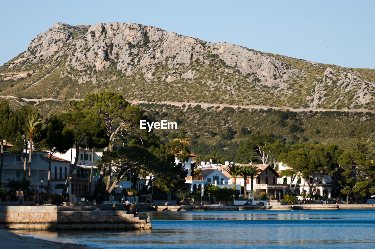 Houses and mountain against sky