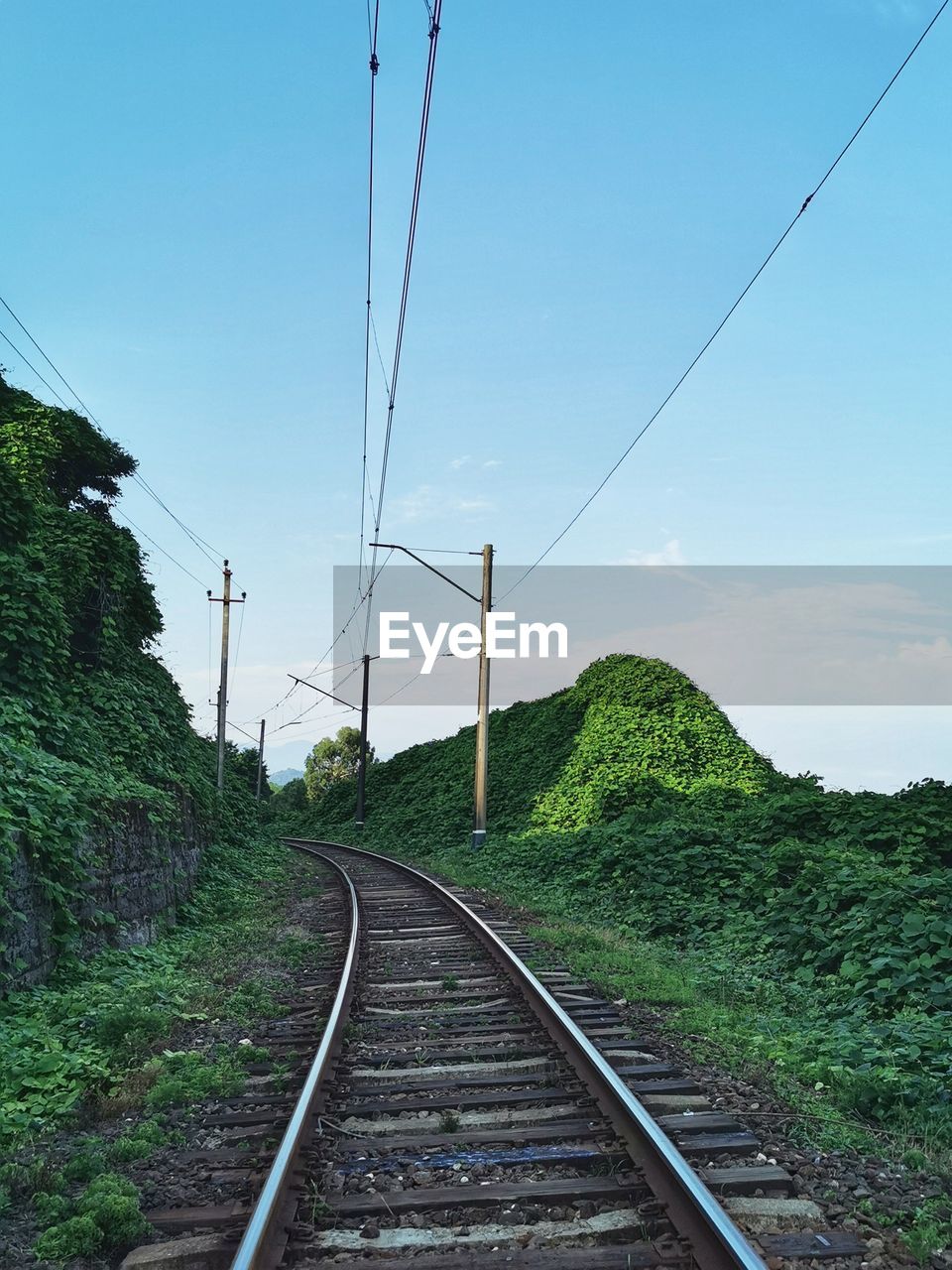 Railroad tracks against clear sky