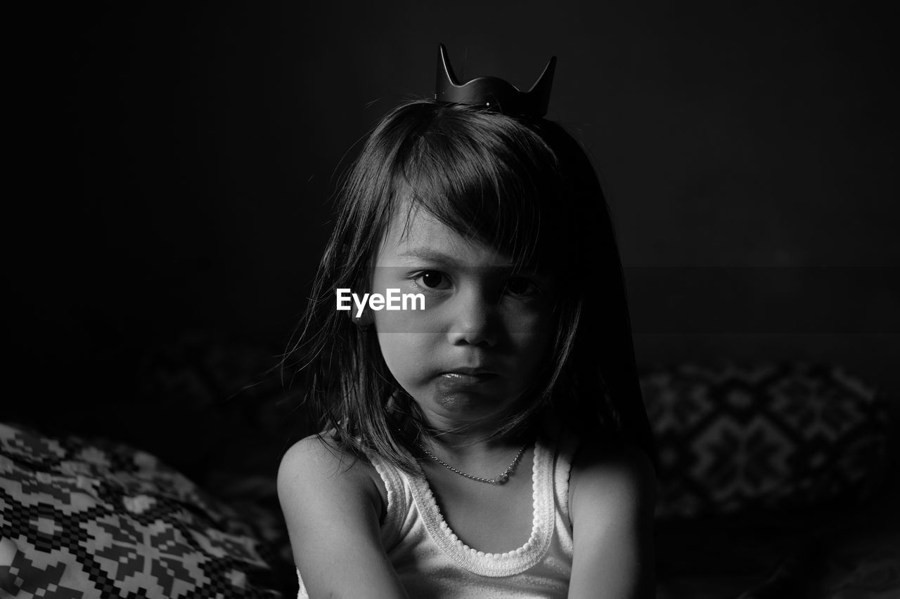 Portrait of cute girl in darkroom