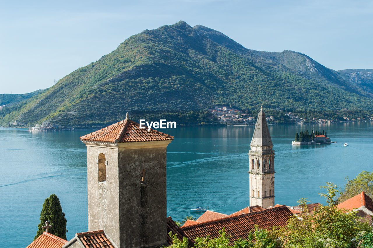 view of townscape by sea against mountain