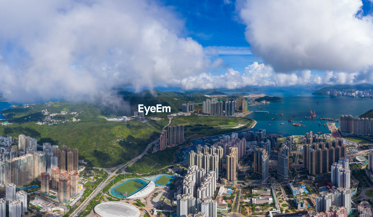 high angle view of city buildings against sky