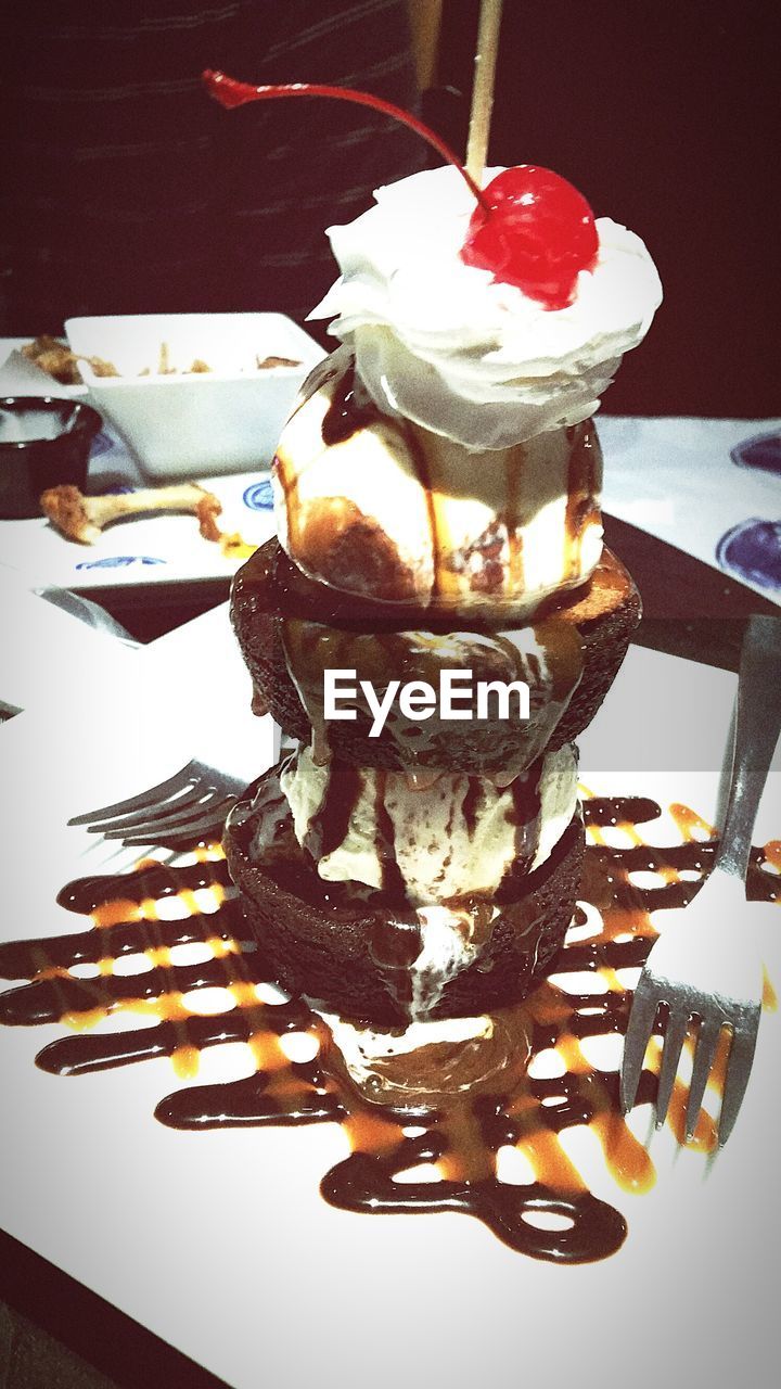 CLOSE-UP OF PASTRY ON TABLE