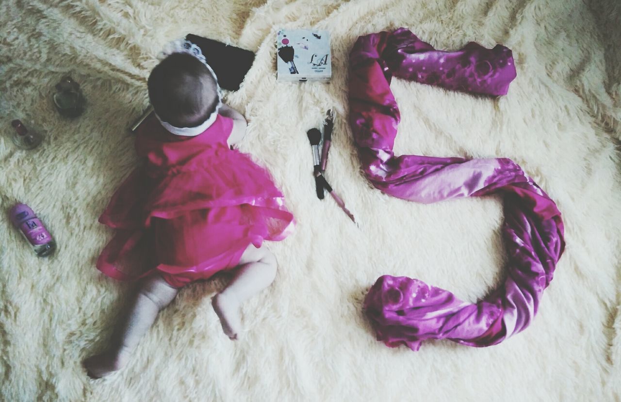 HIGH ANGLE VIEW OF GIRL STANDING ON PURPLE