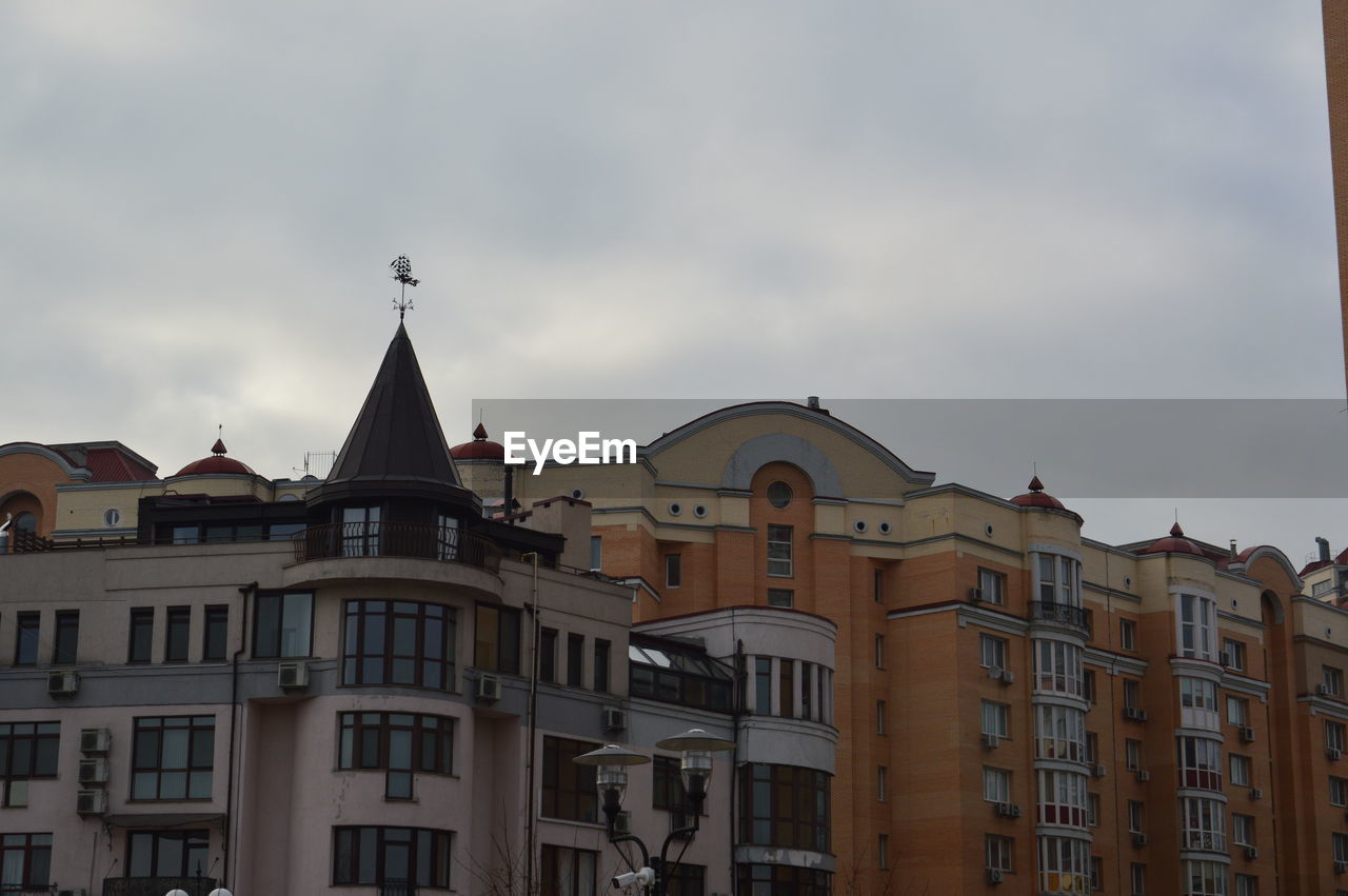 LOW ANGLE VIEW OF BUILDINGS IN TOWN