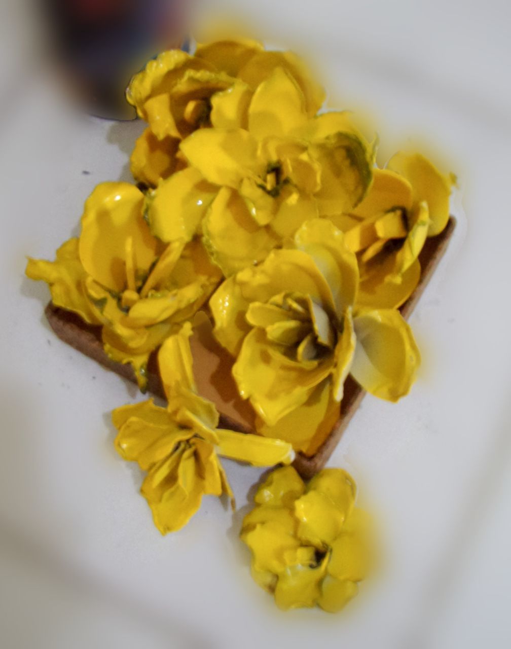 CLOSE-UP OF YELLOW ROSES IN CONTAINER