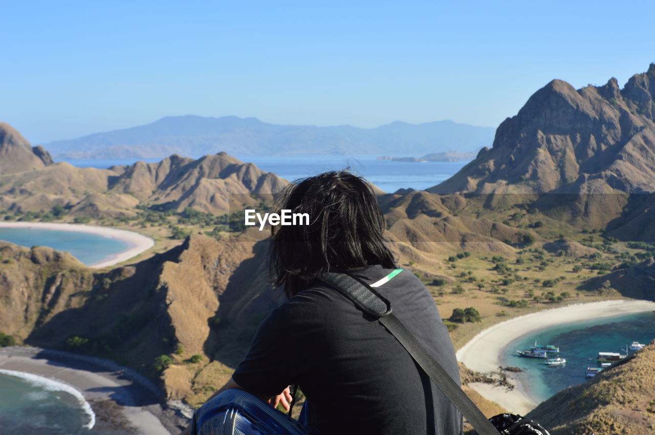 Rear view of man looking at mountains