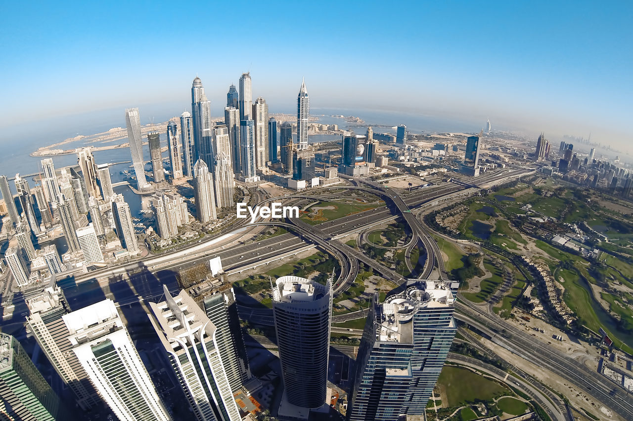 High angle view of city buildings against sky