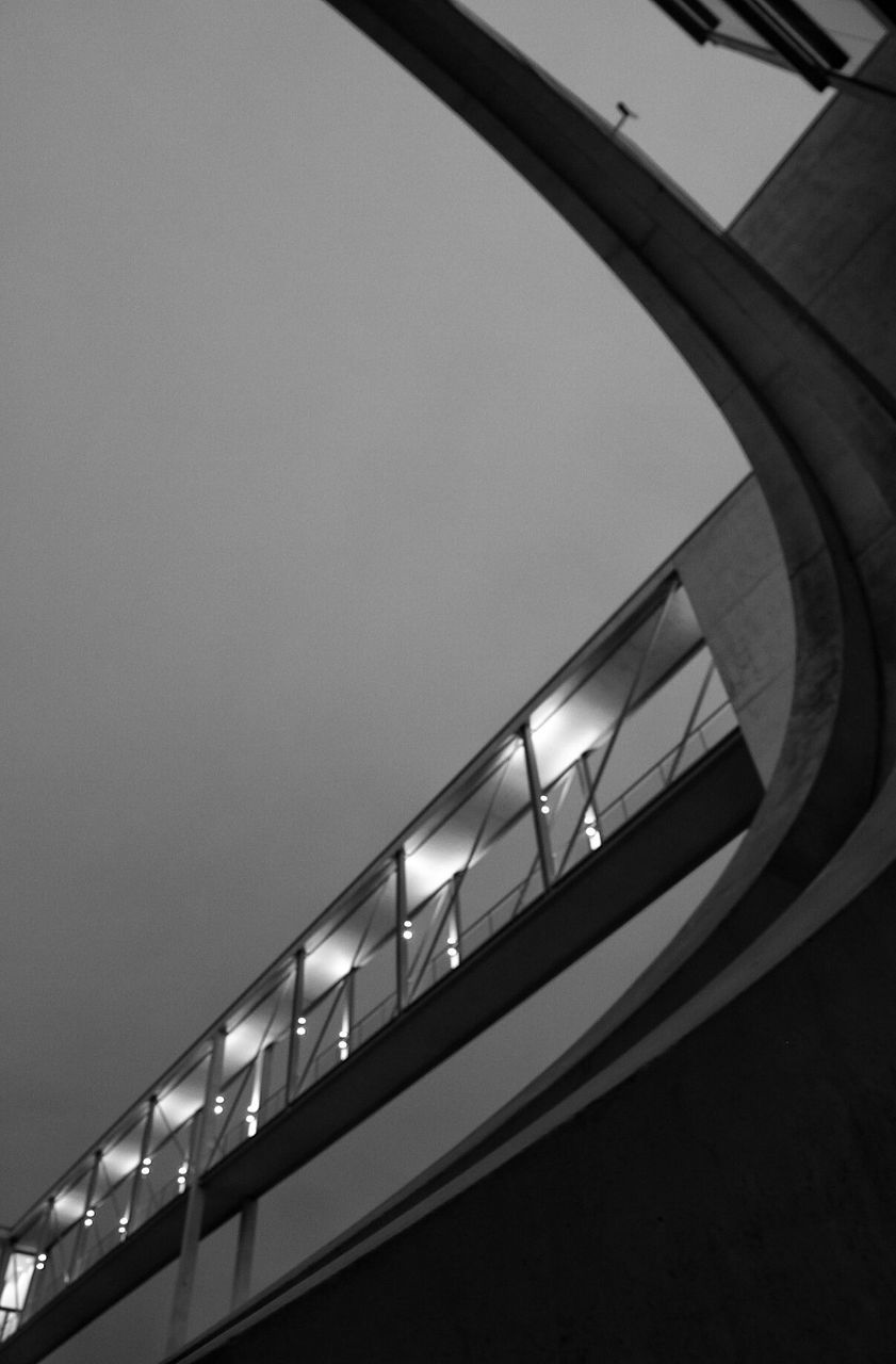 Low angle view of illuminated bridge against sky