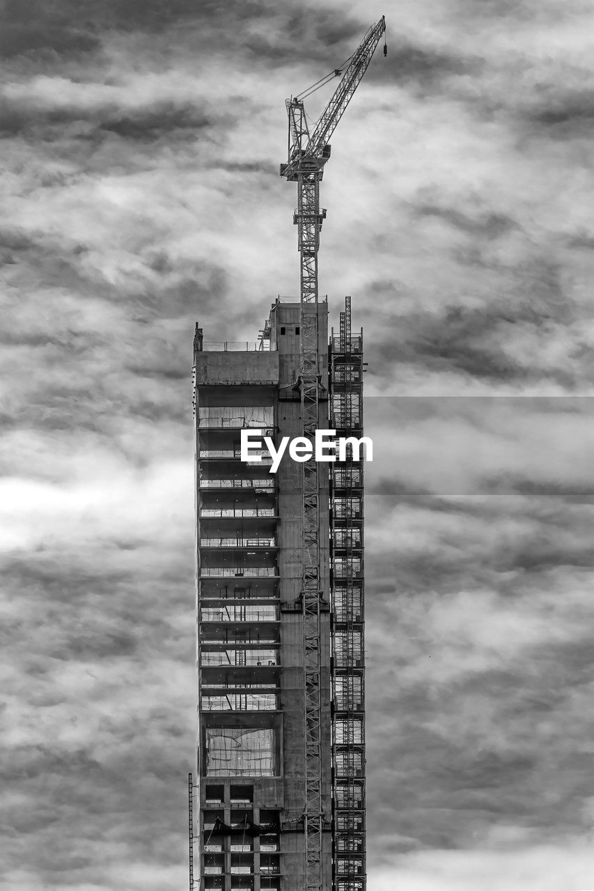 black and white, architecture, built structure, tower, skyscraper, sky, cloud, tower block, monochrome photography, building exterior, monochrome, crane - construction machinery, building, construction industry, construction site, city, machinery, development, no people, nature, industry, low angle view, outdoors, office building exterior, day, landmark, spire, business finance and industry