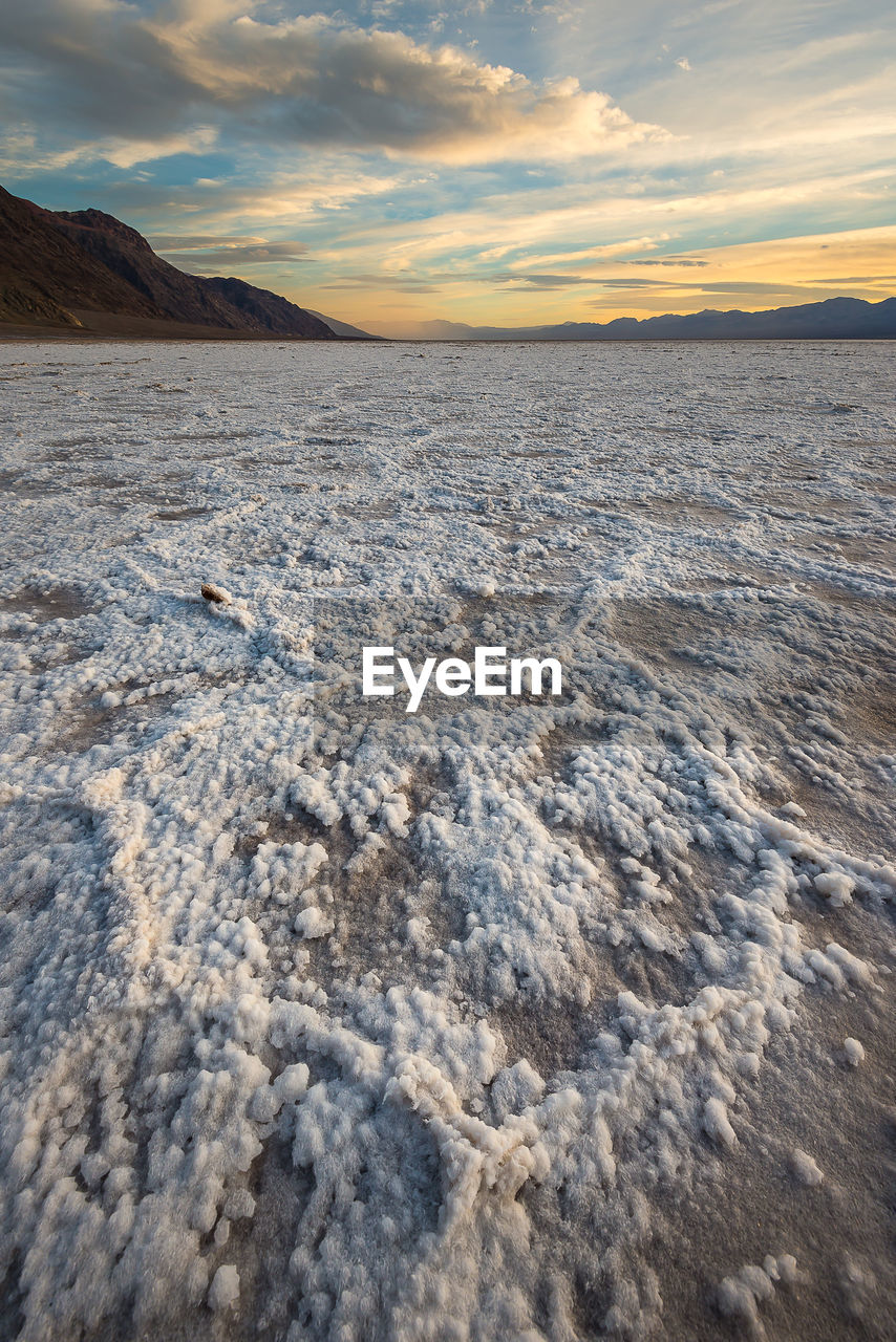 SCENIC VIEW OF LAND DURING SUNSET