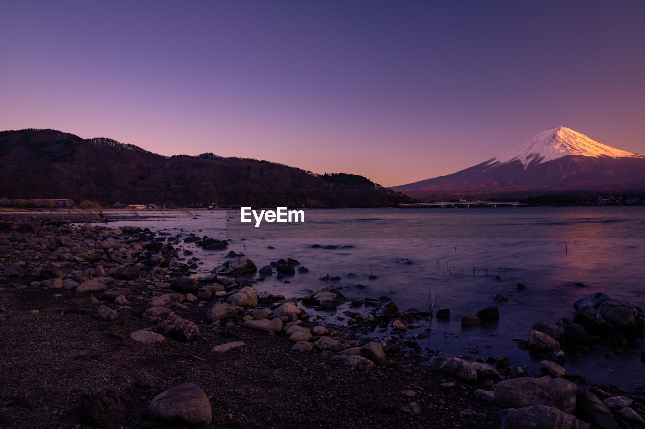 SCENIC VIEW OF ROCKY MOUNTAINS AGAINST CLEAR SKY