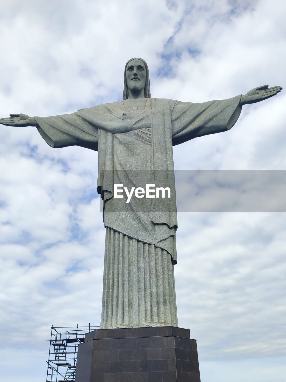 statue, sky, sculpture, cloud, architecture, human representation, low angle view, religion, no people, nature, travel destinations, representation, day, belief, craft, travel, history, the past, spirituality, outdoors, memorial, built structure, airplane, monument, male likeness, aircraft, tourism, art