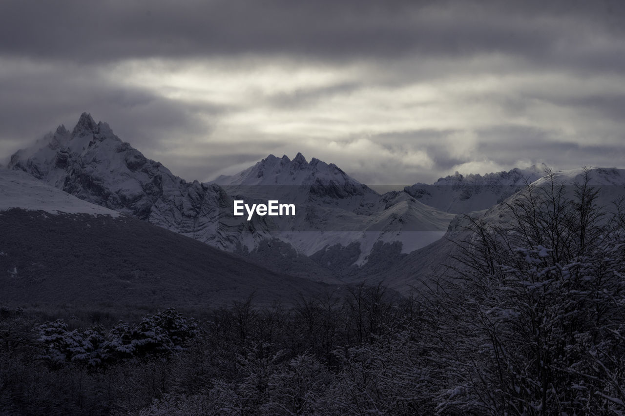 Scenic view of snowcapped mountains against sky