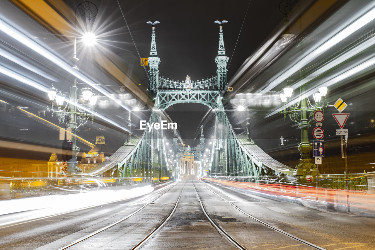 Illuminated liberty bridge at night