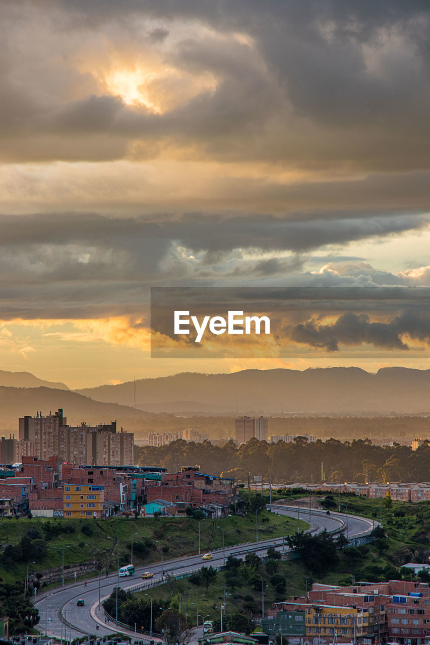 High angle view of buildings against sky during sunset