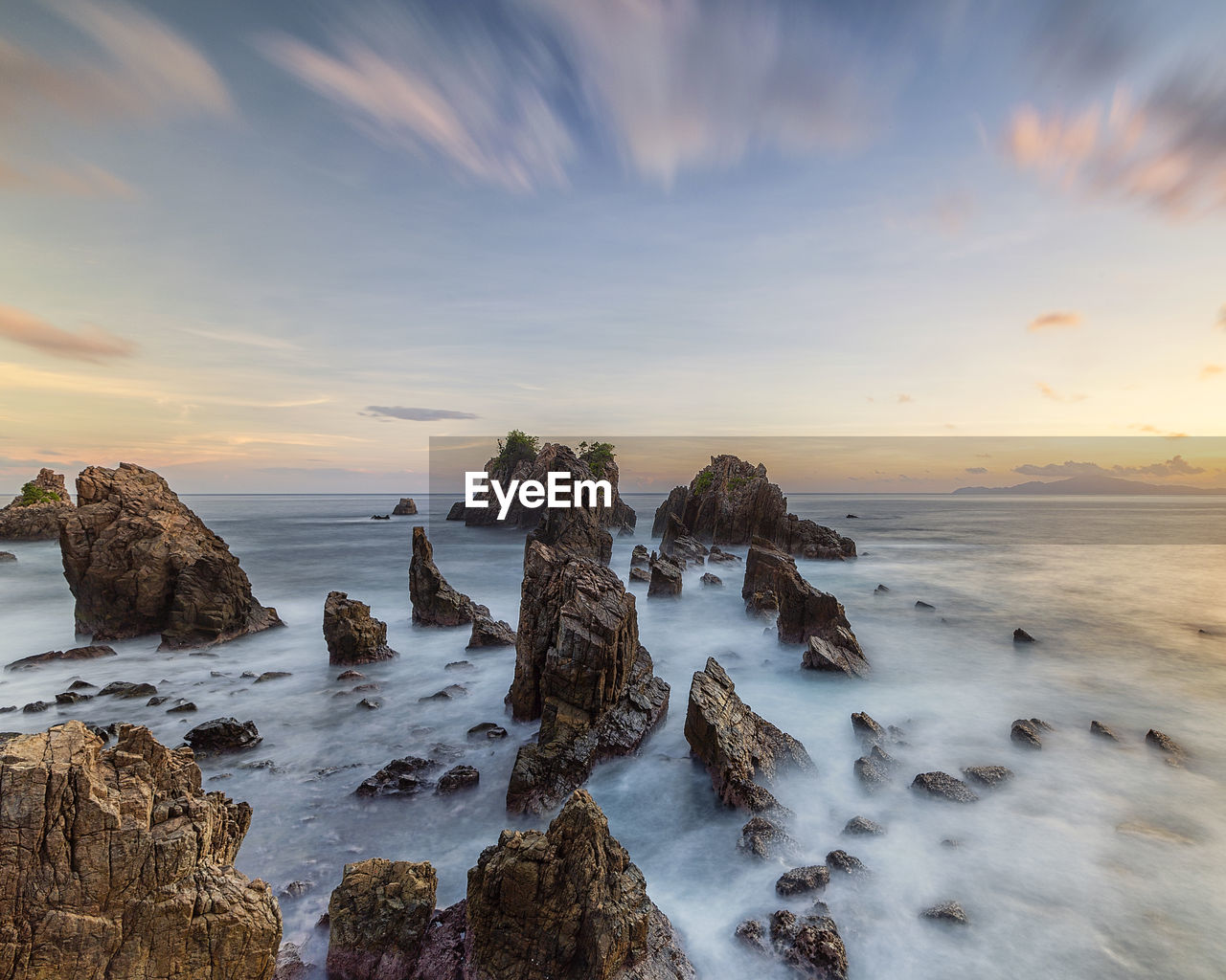 Panoramic view of beach against sky during sunset