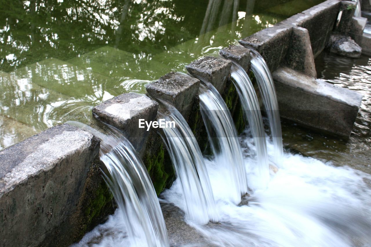 High angle view of water falling over wall